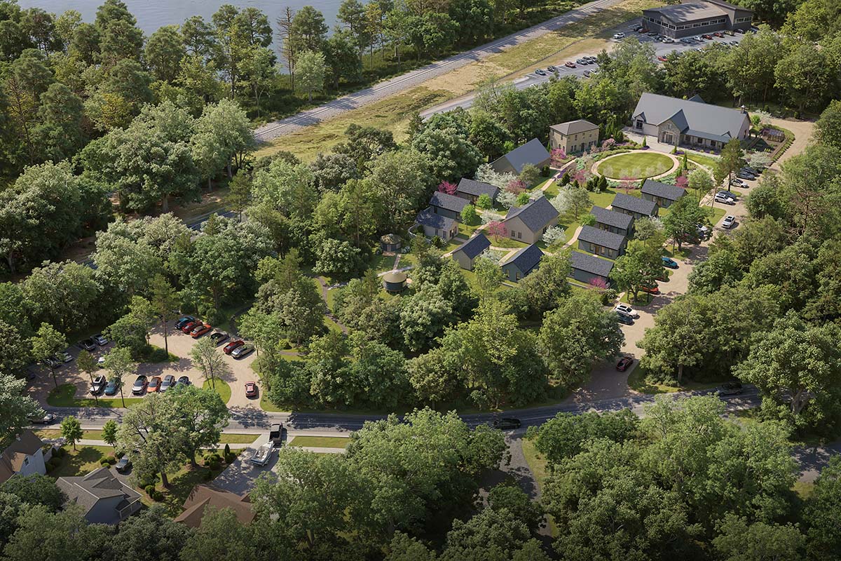 aerial view of a neighborhood with trees and a road